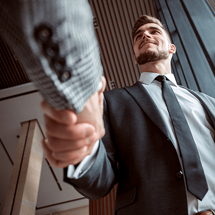 man shaking hands with banker