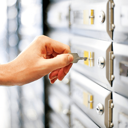 hand putting key in lockbox