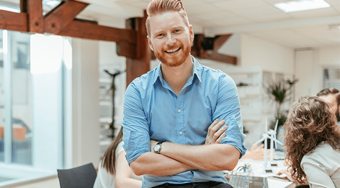 man in conference room smiling