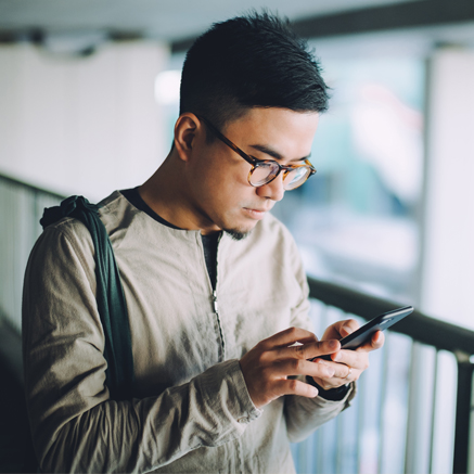 man looking at mobile phone