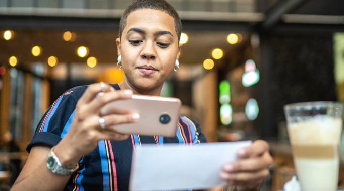 Woman Making Mobile Deposit with Phone