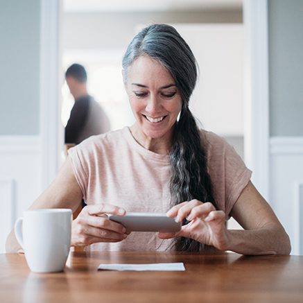 woman depositing check with mobile phone